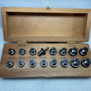 Wooden box with metal plug gauges inside.