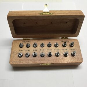 Wooden box with helicoil thread inserts inside.