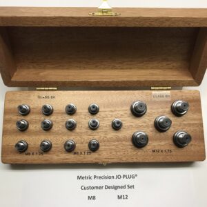 Wooden box with precision metric plugs set.