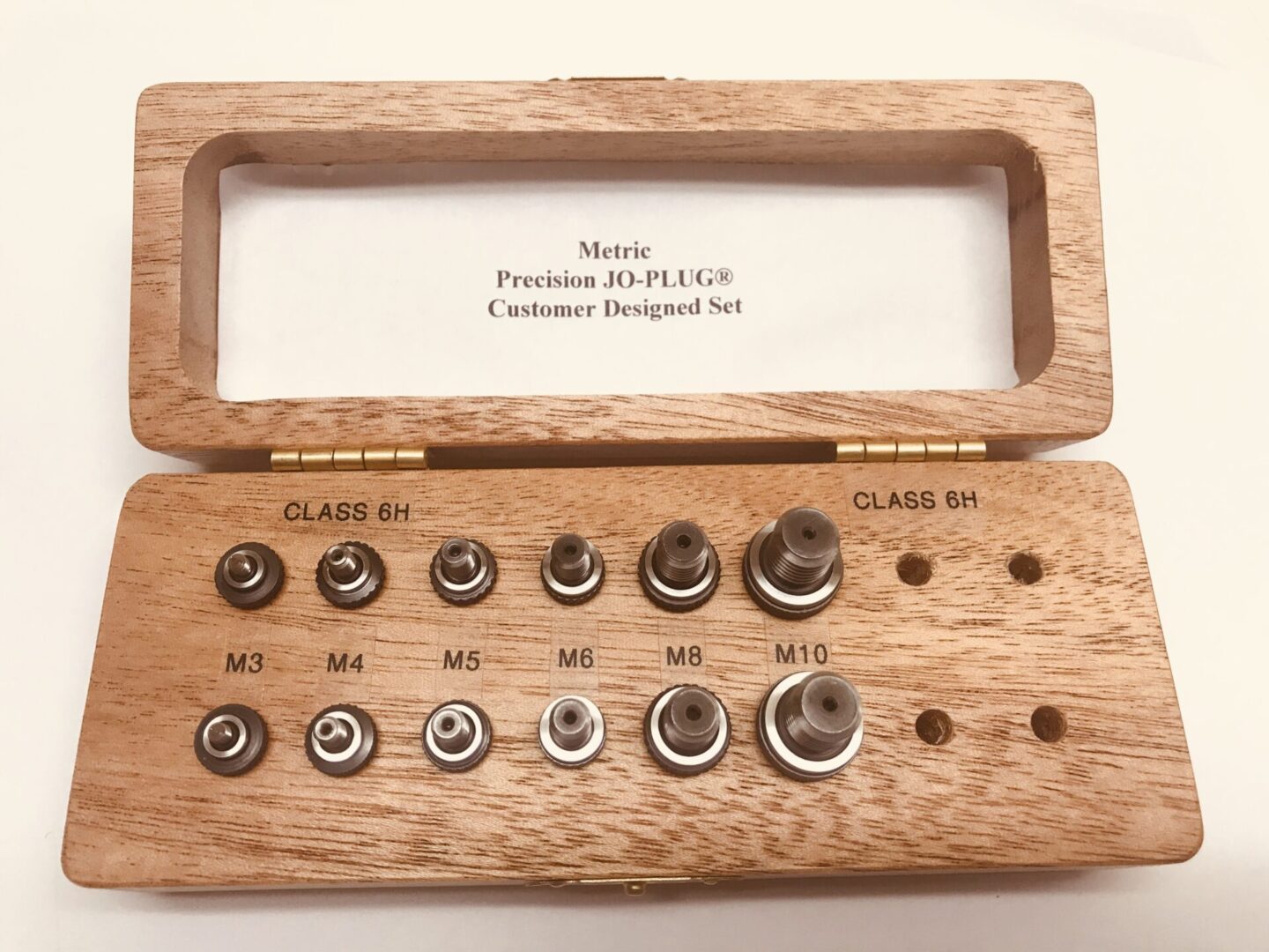 A Metric Set In Wood On A White Background