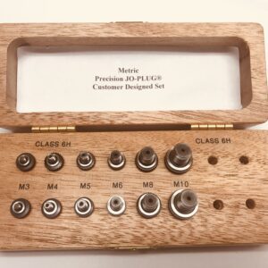 Wooden box with metric precision plugs set.